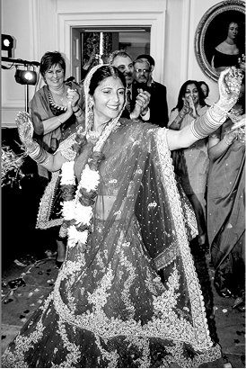 Bride dancing in traditional dress, black and white