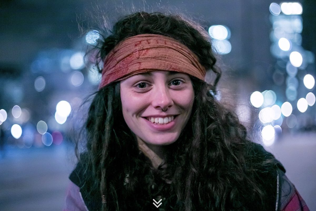 Woman in a headscarf at night