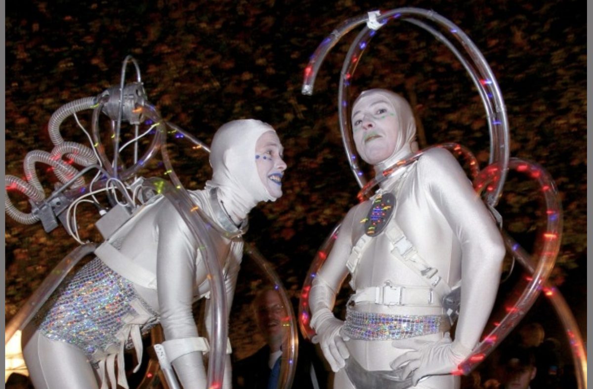 Performers in silver costumes at a Southwark event
