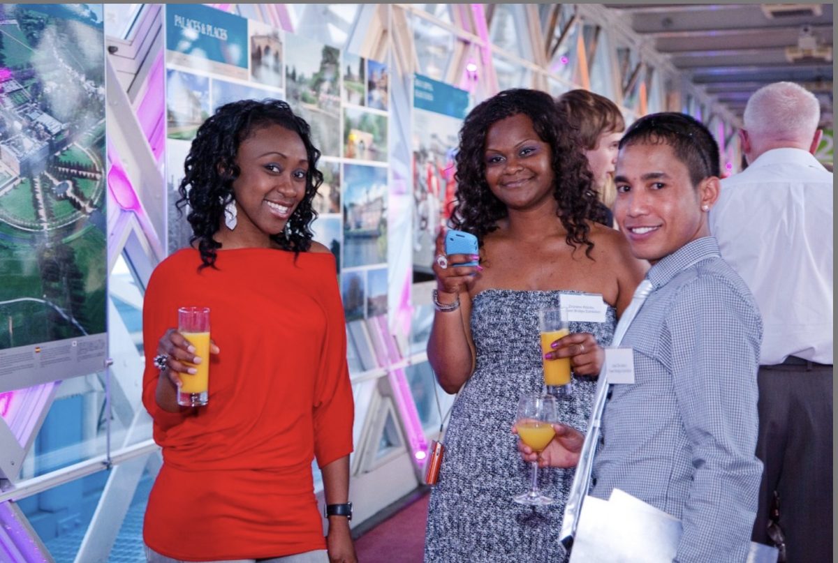 Three guests with orange juice at a book launch